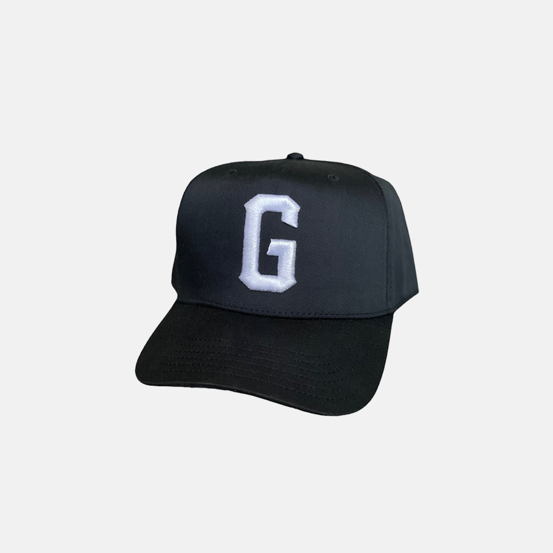 Black Trucker Hat with a White Logo on the Front, Adjustable Strap, Curved Brim, and Good Fortune curved in the back